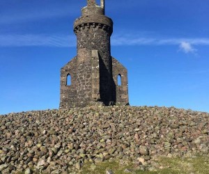Johnston Tower against a blue sky by Karen Will Johnston Tower blue sky